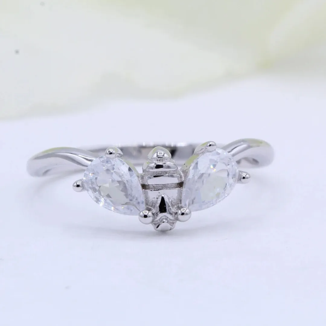 /public/photos/live/Minimalist Pear Cut Moissanite Honeybee Ring 671 (1).webp